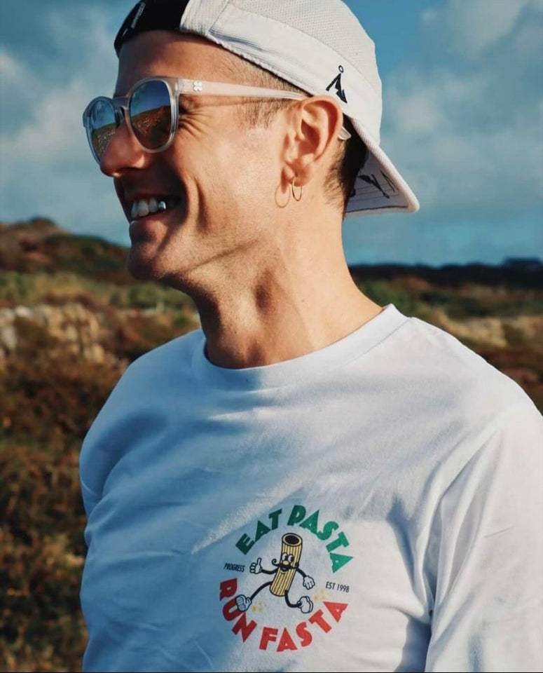 hansome man wearing Progress Running Club Australia Eat Pasta Run Fasta organic tee shirt white italy