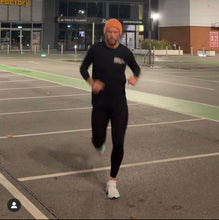 Load image into Gallery viewer, Handsome man runs in Progress Running Club Australia All inclusive fuck racism organic tee shirt
